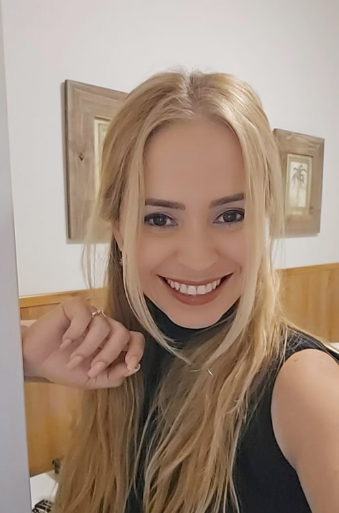 Madeline Casco working on her laptop